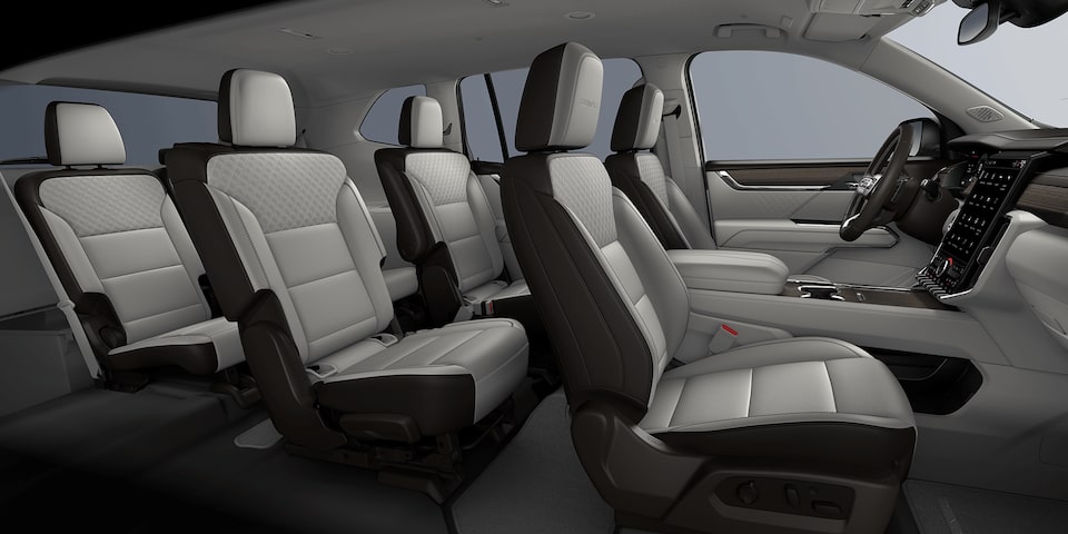 2024 GMC Acadia Denali front interior seats: Sheer Grey/Very Dark Atmosphere.