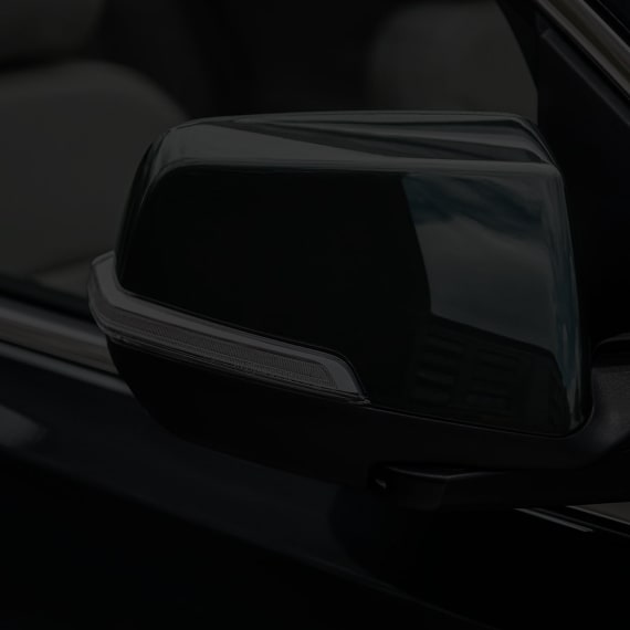 Close up view of the exterior side mirror used for the 2024 GMC Acadia.