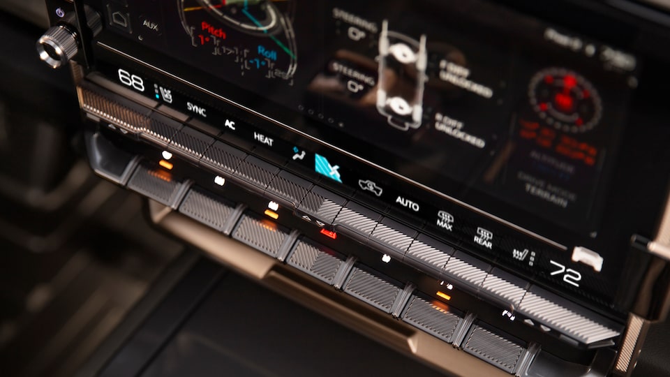 Close-up of the Feature Controls in a 2025 GMC Hummer EV Truck.