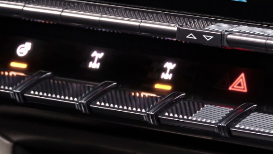 Close-up view of the 2025 GMC Hummer EV Pickup Truck's Front and Rear E-Locker Controls on Dashboard.