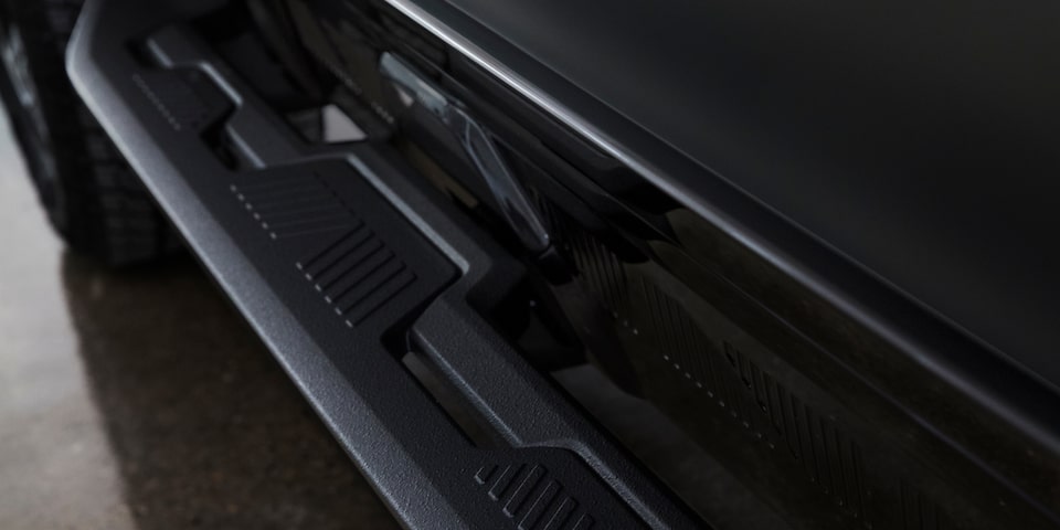 Side close-up view of the rock sliders for the 2025 GMC Hummer EV SUV.