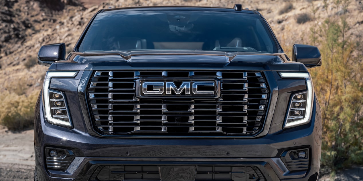 Front view of the 2025 GMC Yukon parked on a canyon.