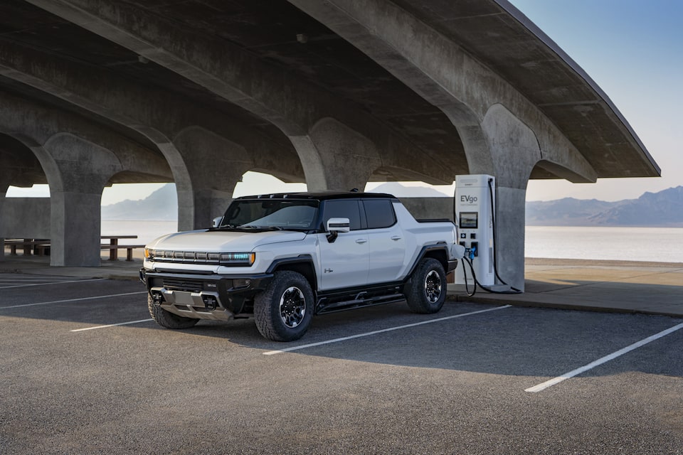 Scenic view of the GMC Hummer EV Pickup at a public charging station.