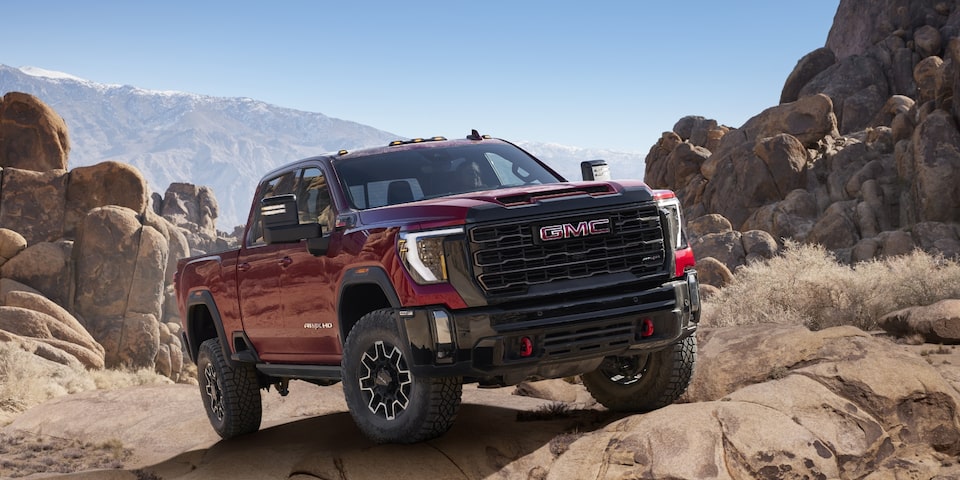 2024 GMC Sierra HD AT4X on rough terrain.