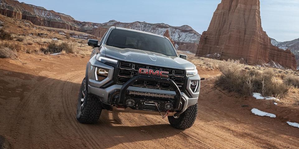 Front View of a 2025 GMC Canyon Driving Through a Desert.