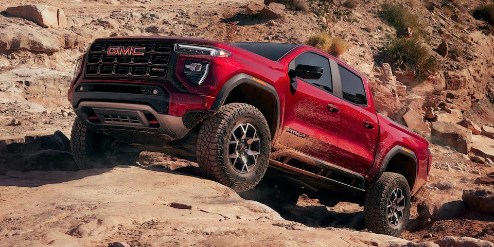 2025 GMC Canyon AT4 parked in a desert terrain.