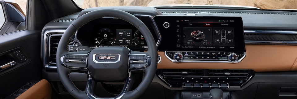 The 2025 GMC Canyon AT4's Steering Wheel and Infotainment System.