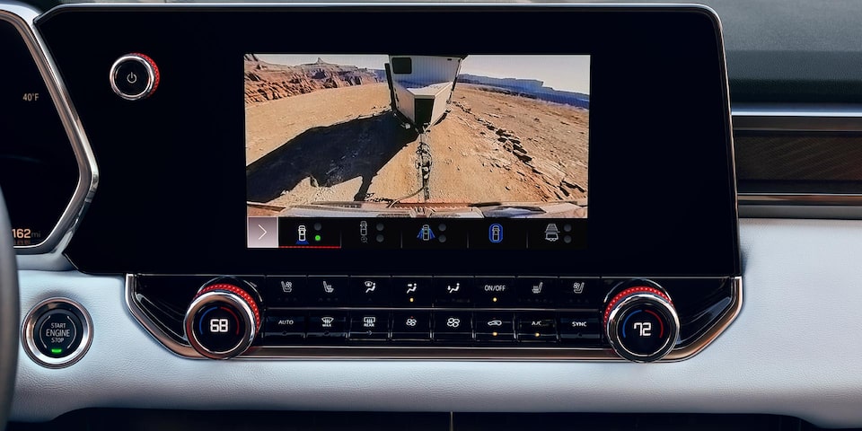 The 2025 GMC Canyon AT4 Display Screen Showing Camera View 1 Towing a Trailer.