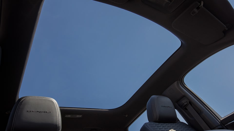 Interior view of the panoramic glass roof on the 2025 GMC Sierra EV Denali.