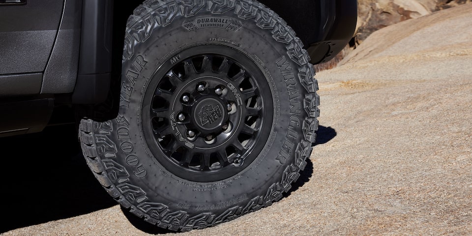 Close-up of the wheel on a 2025 GMC Sierra HD AT4X AEV truck.