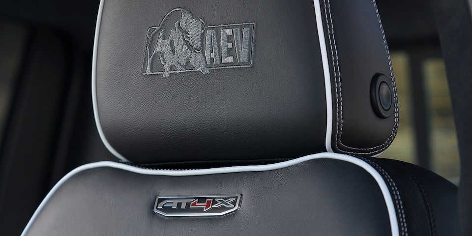 Close-up view of the "AEV" stitching on the seat of a 2025 GMC Sierra HD AT4X truck.