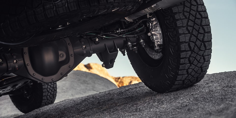 Close-up view of the Powertrain System underneath the 2025 GMC Sierra HD AT4 truck.