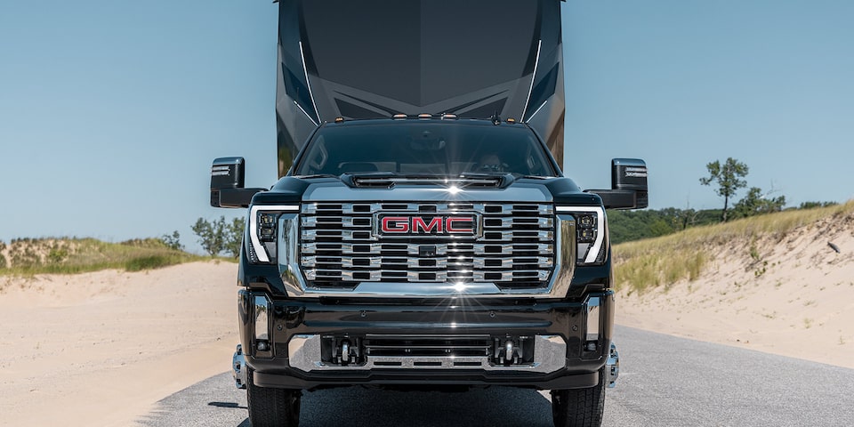 Wide Head-On View of a 2025 GMC Sierra HD Denali Truck Hauling a Trailer