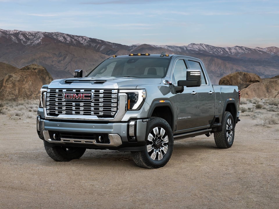 Front-side view of the 2025 GMC Sierra HD Denali parked alone in the desert.