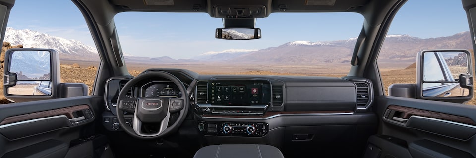 Wide View of the spacious interiors in a 2025 GMC Sierra HD Pro/SLE/SLT Truck.