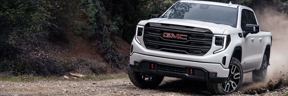 GMC Sierra 1500 AT4 Off-Road Truck Shown Driving Off-Road