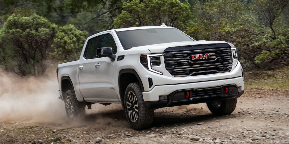 White GMC Sierra 1500 AT4 Shown Driving Off-Road