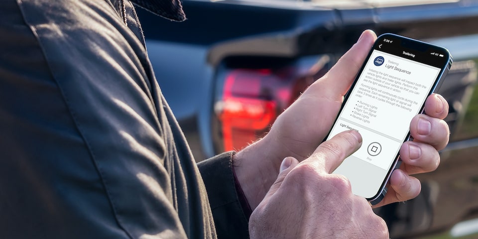 Close-up of a Man Using his MyGMC Mobile App