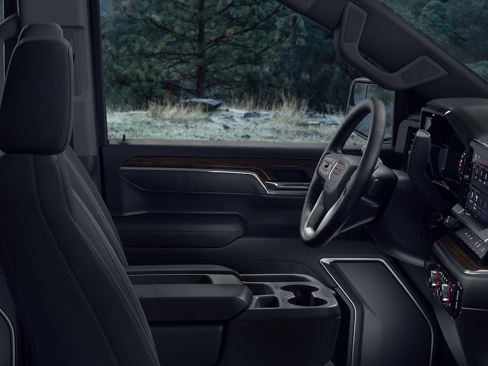 Side Interior View of the Front Row Black Leather Seats in the 2025 GMC Sierra 1500