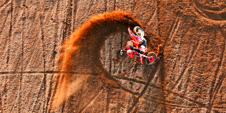 A person Mountain Biking at a Red Bull event.