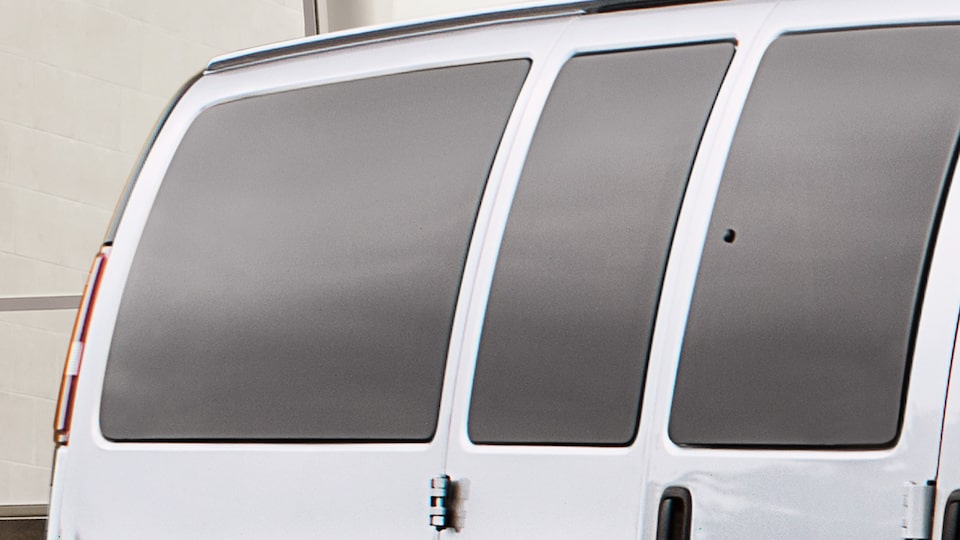 GMC Savana Passenger swing-out rear cargo and side door windows.