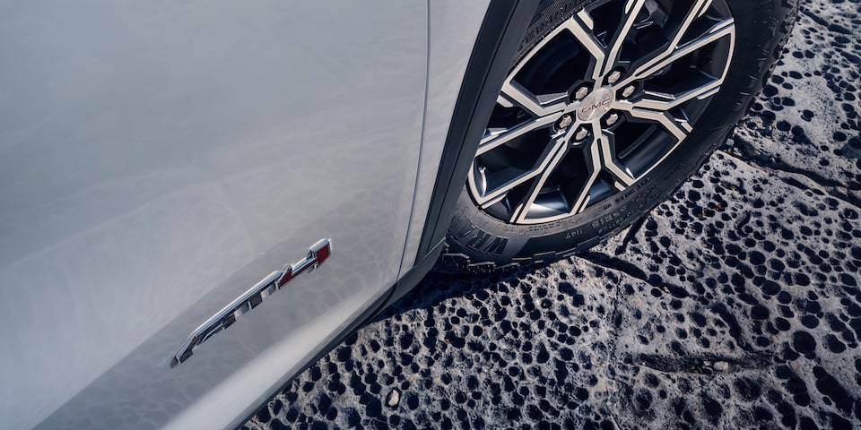 Close up view of a wheel being tilted on the 2025 GMC Acadia AT4.