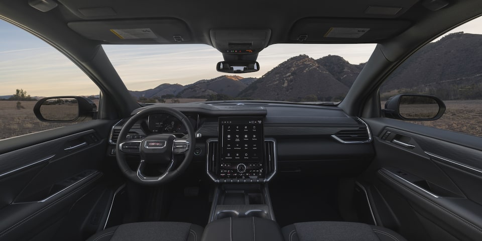 Wide view of the front interiors of the 2025 GMC Acadia Elevation.