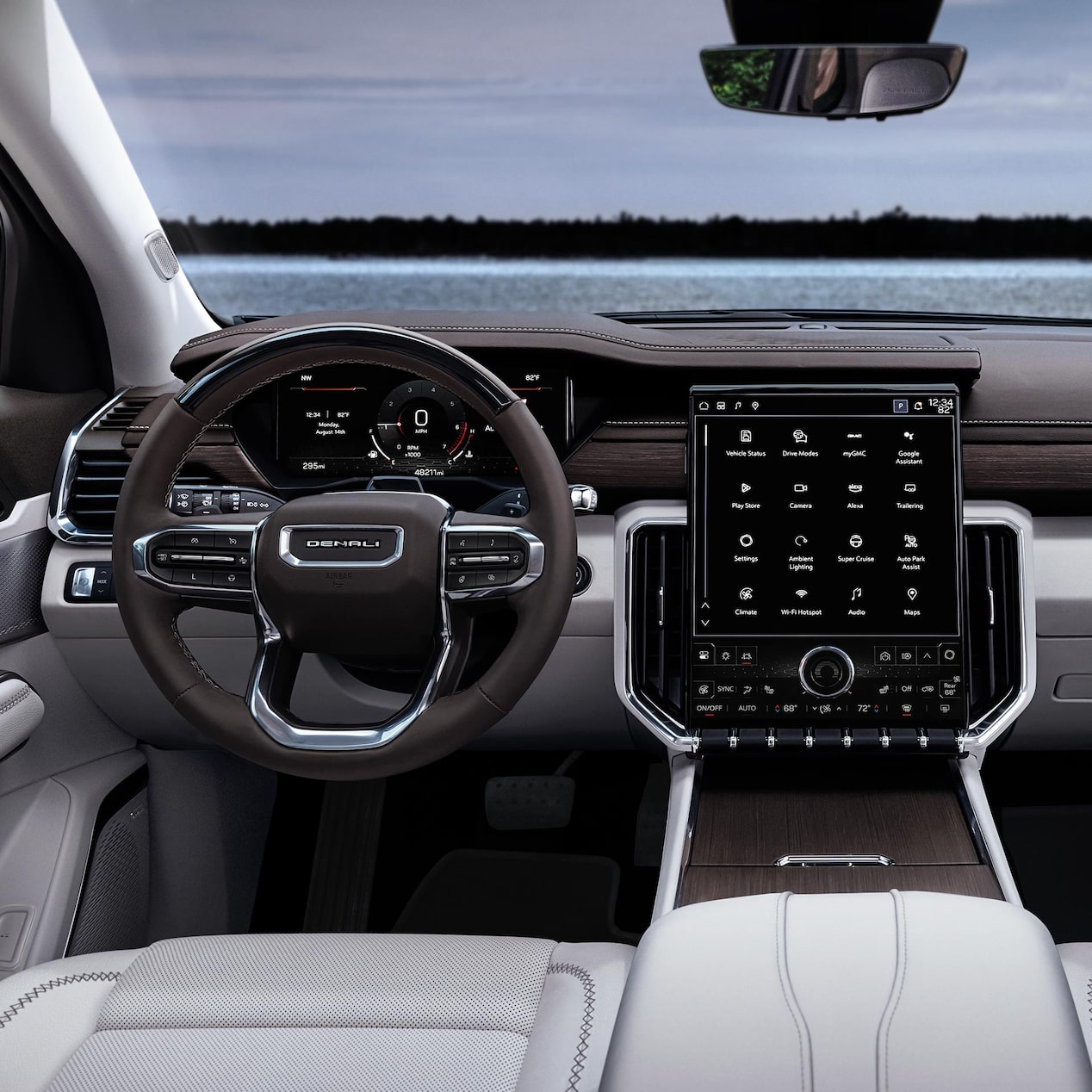 Driver's view of the Steering Wheel and Infotainment Screen in the GMC Acadia Mid-Size SUV.