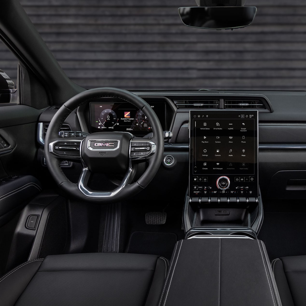 Driver's view of the Steering Wheel and Infotainment Screen inside the GMC Terrain.