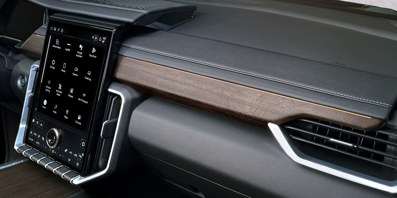Close-up of the Premium Wood Trim on the Dashboard of the 2026 GMC Acadia Denali Ultimate.