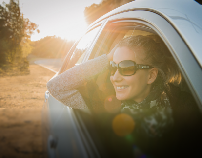 A person looking out from the front passenger's seat eligible for GM's Preferred Pricing Program.