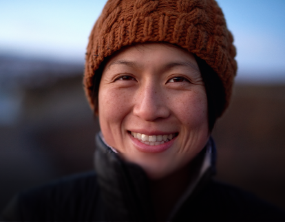 A person smiling eligible for GM's Welcome to Canada Program.