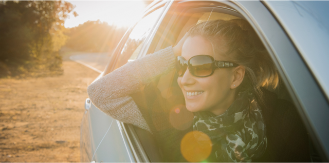 A person looking out from the front passenger's seat eligible for GM's Preferred Pricing Program.