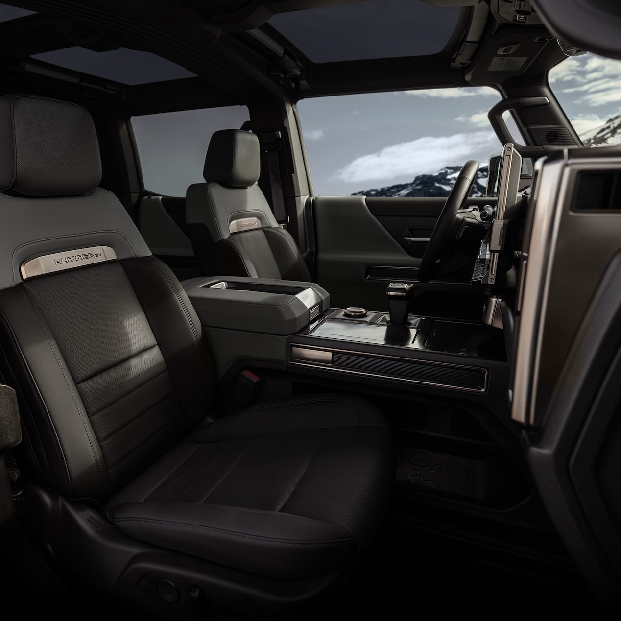 Front passenger's view of the steering wheel and infotainment screen in the GMC HUMMER Electric Truck.