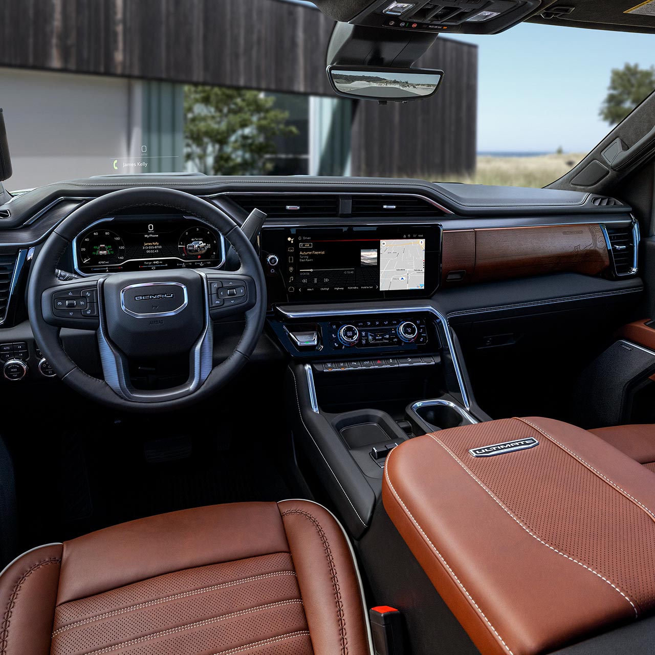 Interior View of the Steering Wheel and Infotainment Screen inside the GMC Sierra HD Pickup Truck.