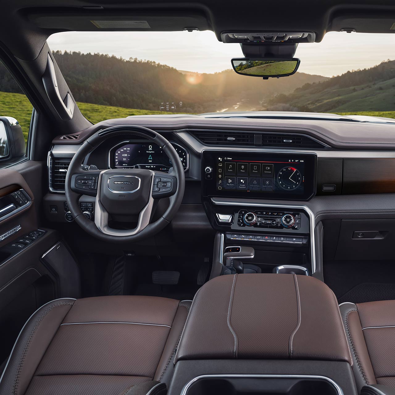 Interior view of the steering wheel and infotainment screen inside the GMC Sierra 1500 Full-Size Truck.