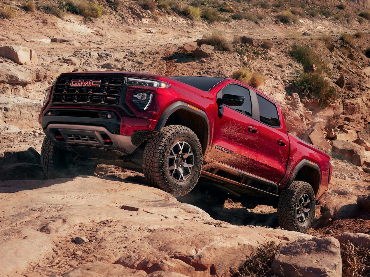 2024 GMC Canyon using the off-road suspension capability on a steep canyon.