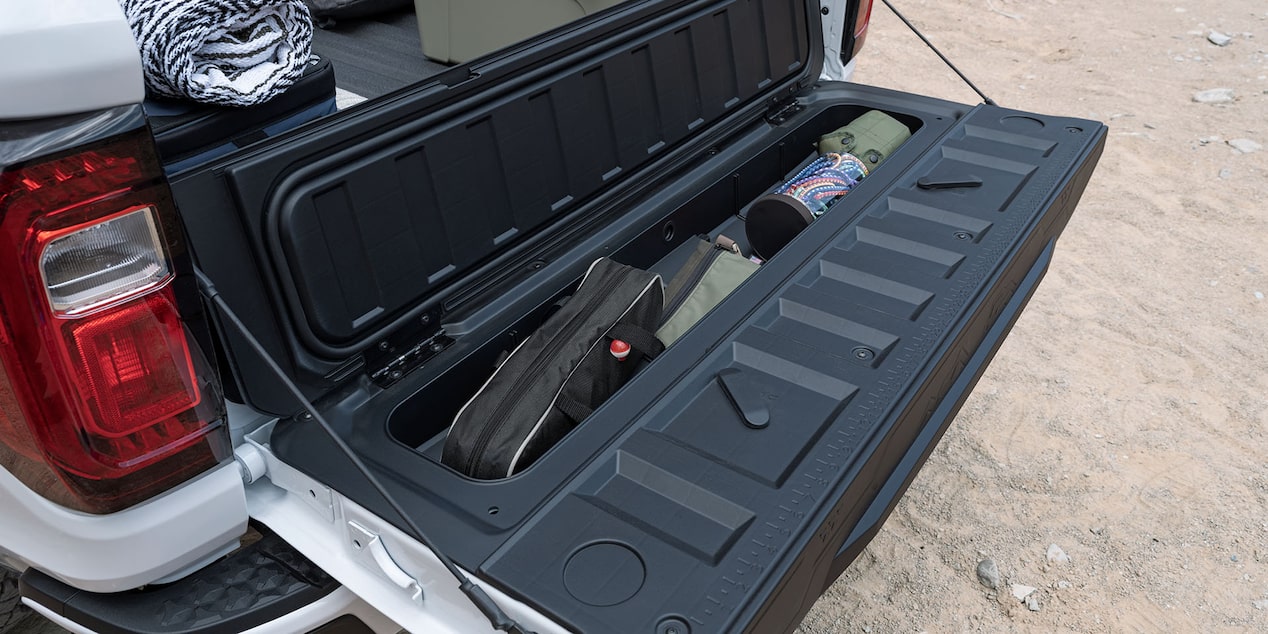 Stowed equipment on the cargo bed of the 2024 GMC Canyon.