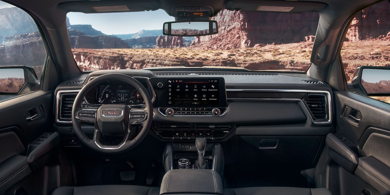 Jet black cloth interiors of the 2024 GMC Canyon Elevation.