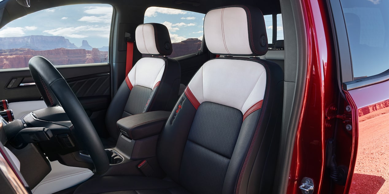 side close-up view of the power driver seat on the 2024 GMC Canyon.