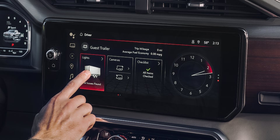 Close-up of Driver Pressing a Feature on the Infotainment System