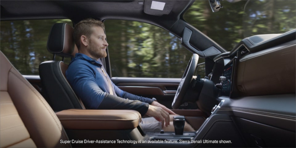 Profile View of a Man Driving Using the Super Cruise Hands-Free Driving Assistance Technology