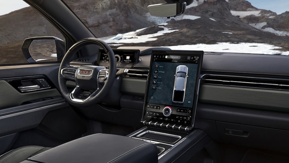 Rear Passengers View of the Infotainment System, Steering Wheel and Seats of the GMC Sierra EV